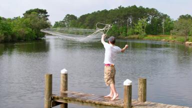 A boy goes crabbing in a Louisiana bayou 